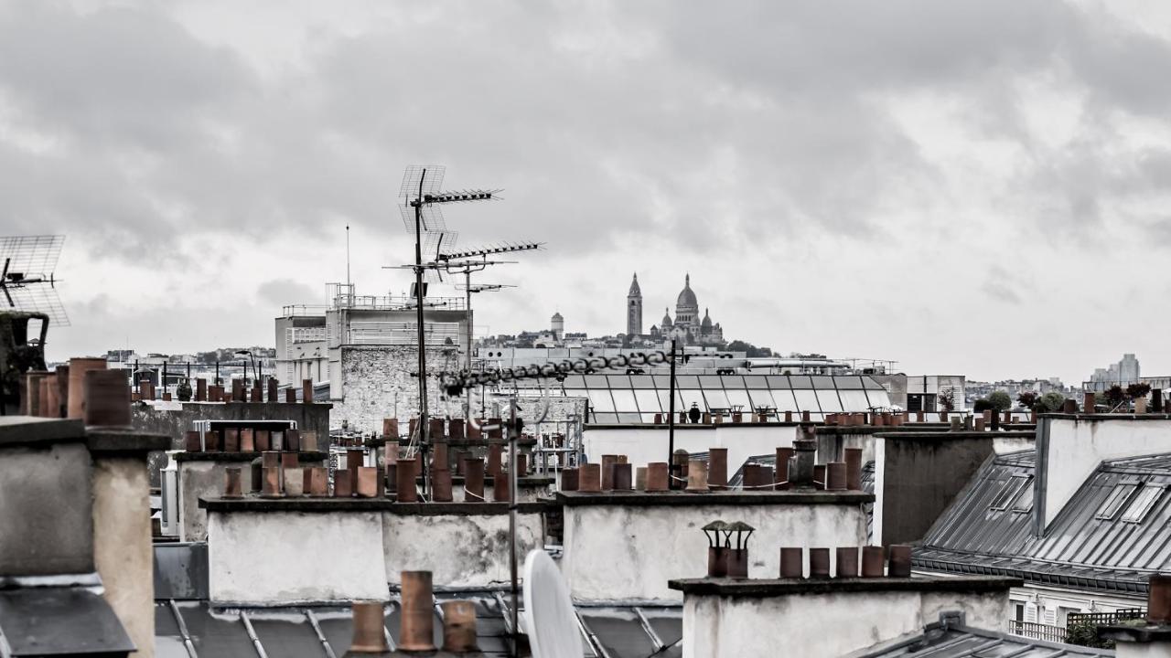 무슈 조지 호텔 앤 스파 샹 젤리제 파리 외부 사진 View of Paris rooftops