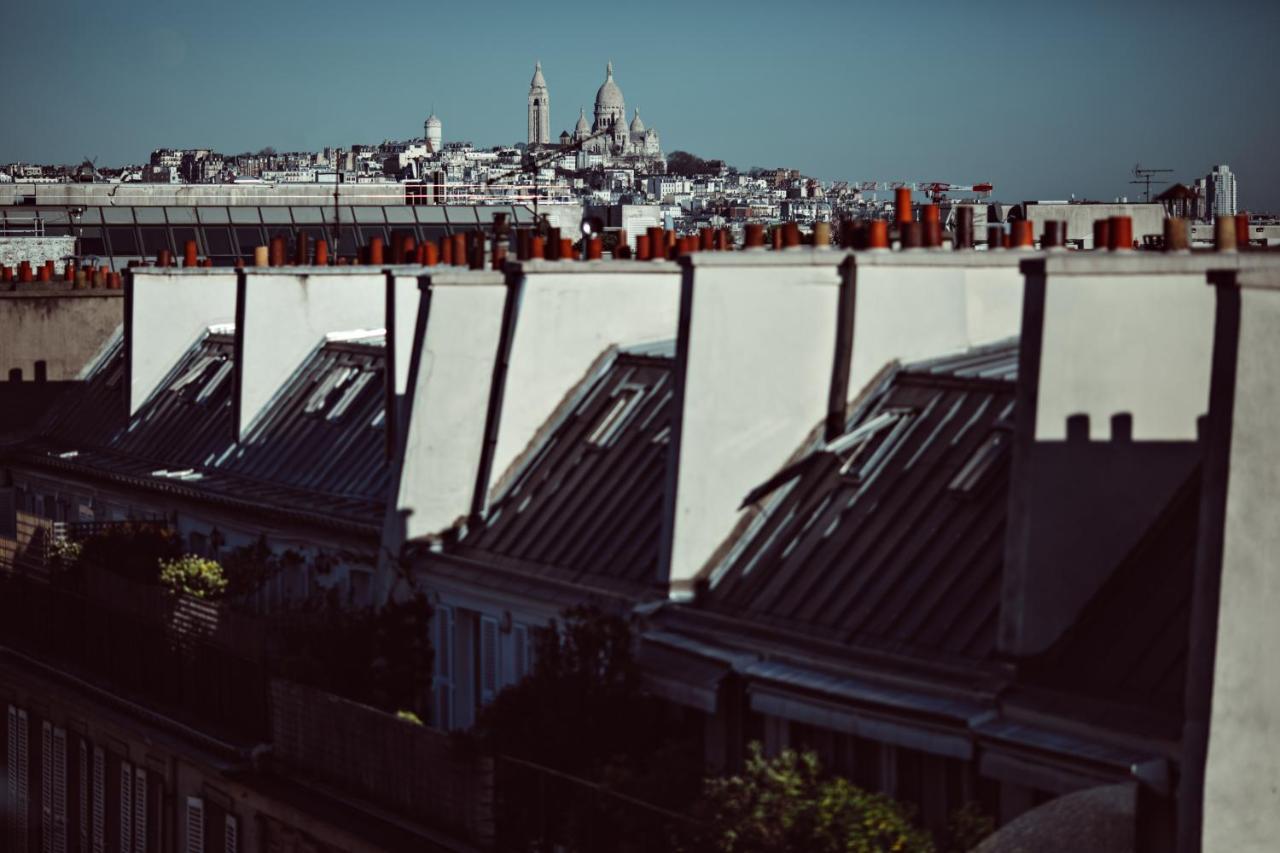 무슈 조지 호텔 앤 스파 샹 젤리제 파리 외부 사진 View of the roofs of Paris